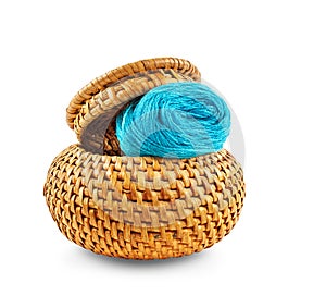 Wicker box of yellow color with dark blue thread