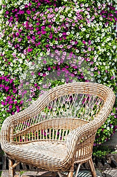 wicker chair on a flower wall background