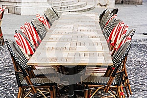 Wicker chairs and stone tables in the garden restaurant, outdoor