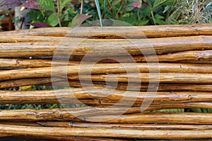 Wicker fence made of brown sticks