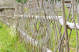 Wicker fence made of natural branches, beackground, texture