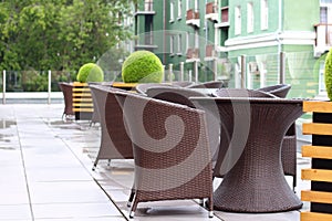 Wicker furniture in summer cafe on cinema terrace