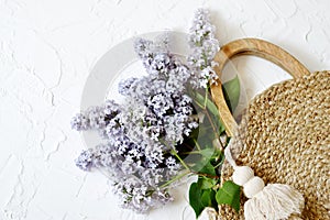 Wicker Handbag with Lilac Flowers , Spring Time, Summer Concept