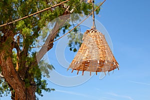 Wicker lamp in a beach tavern