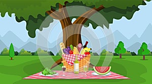 WIcker picnic basket full of products.