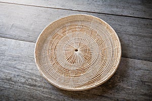 Wicker placemat on wooden