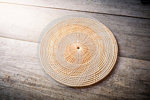 Wicker placemat on wooden