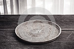 Wicker placemat on wooden
