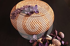 Wicker rattan box craft round on top with dried flowers and lavender