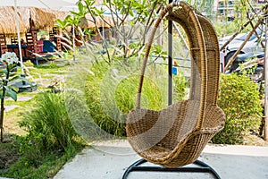 Wicker rattan hanging chair in loft cafe