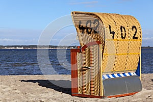 Wicker roofed beach chair photo