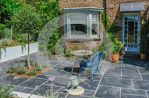 Wicker table and chair on an empty patio area