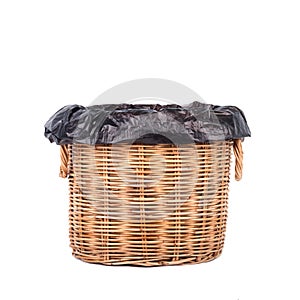 Wicker trash basket on white background