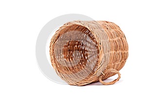 Wicker trash basket on white background