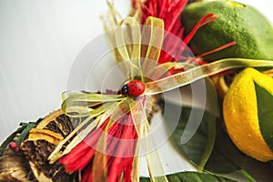 Wicker wreath with heart-shaped, decorated with leaves, lemon, dried lemon