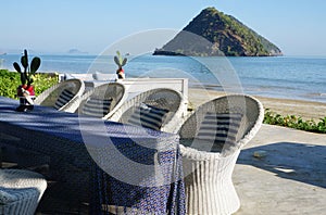 Wickerwork chair on the beach