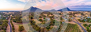 Wide aerial panorama of Grampians mountains and countryside at sunset.