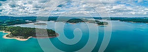 Wide aerial panorama of scenic lake.