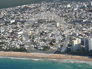 Wide, aerial shot of Puerto Rico, Caribbean Islands from an airplane window