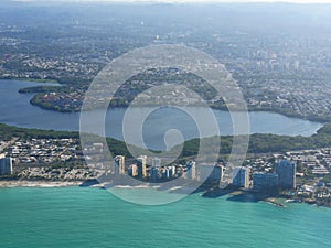 Wide aerial shot of Puerto Rico coastal areas, Caribbean Islands from an airplane window