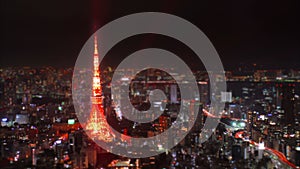 Wide aerial time-lapse shot of Tokyo Tower at night, Japan.