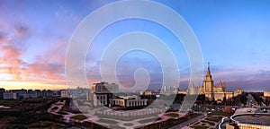 Wide angle aerial panorama of autumn campus of Moscow University under dramatic sunset cloudy sky