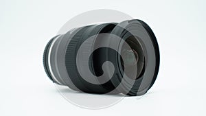 Wide angle camera lens lying isolated on a white background