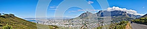 Wide angle of Cape Town and mountain landscape on a sunny day. Beautiful view of a city against a blue horizon. A