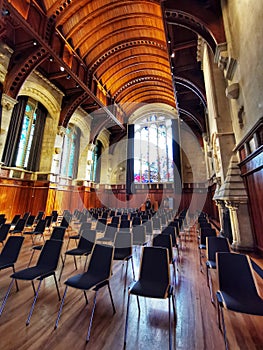 A wide-angle image of raws of chairs at the University of Canterbury main assembly hall