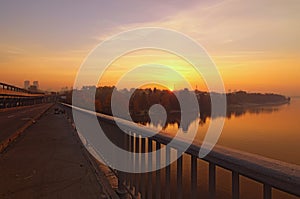 Wide angle landscape panorama of Dnipro River. Magnificent autumn sunrise in Kyiv. Foggy morning landscape