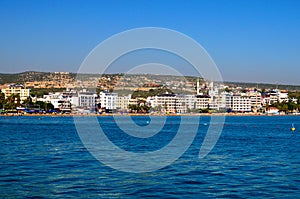 Wide angle landscape view of blue water of Mediterranean Sea and city beach, embankment with many hotels in Kizkalesi