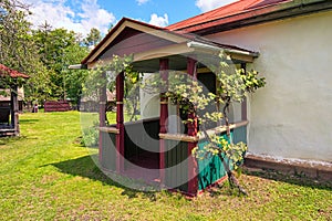 Wide-angle landscape view of homestead of rich countryman. Entrance to a residential building with large front yard