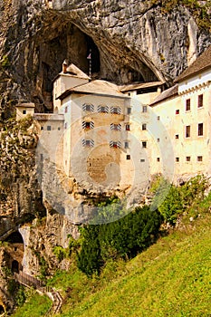 Wide angle landscape view of medieval Predjama castle Slovene. Predjamski grad. It was built in the cave