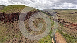 Wide angle Oblique Aerial landscape view of unamed waterfall and canyons in the Cockburn Ranges, El Questro Resort, Kimberley,