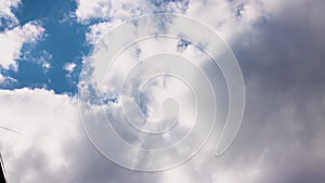 Wide angle panorama of blue sky with white clouds.