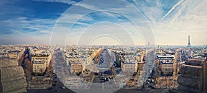 Wide angle Paris cityscape panorama from the triumphal arch with view to parisian avenues and Champs-Elysee in the center.