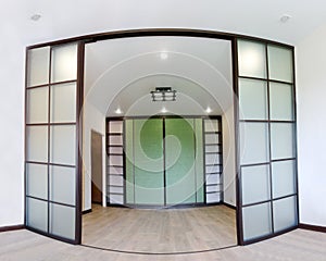 Wide angle photo of the repair of interior of new living room with sliding doors coupe in Japanese style Shoji.