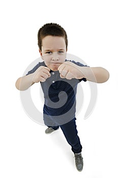 Wide angle, Serious White Fighter Male Kid Posing with Closed Fists While Looking at the Camera