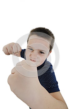 Wide angle, Serious White Fighter Male Kid Posing with Closed Fists While Looking at the Camera