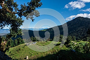 A wide angle shot of Camping in the hills of Himalayan region of Uttarakhand, India with visible Gomukh Glacier peaks in the