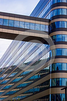 Wide angle shot of a modern colorful building of a corporation with glass windows, modern architecture concept