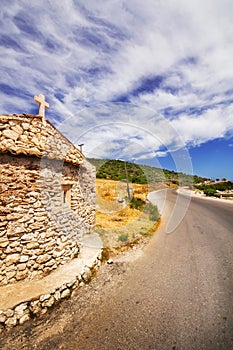 A wide angle shot of a small church on Zakynthos island