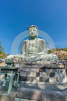 Wide angle side view of The Great Buddha (Daibutsu) of Kamakura, Japan