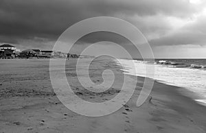 A wide angle view of the beach at Pawleys Island in black and white.