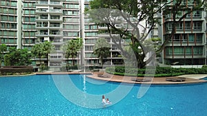 wide angle view of a beautiful swimming pool in the condominium, Singapore holiday, aerial
