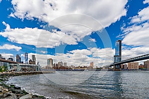Wide angle view Brooklyn Bridge, Manhattan Bridge with lower Manhattan skyline, One World Trade Center Empire Fulton