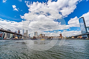 Wide angle view Brooklyn Bridge, Manhattan Bridge with lower Manhattan skyline, One World Trade Center Empire Fulton