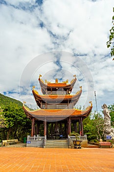 Wide angle view of Ho Quoc pagoda (Vietnamese name is Truc Lam Thien Vien) with big statue of guanyin bodhisattva on mount, Phu