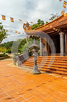 Wide angle view of Ho Quoc pagoda (Vietnamese name is Truc Lam Thien Vien) with big statue of guanyin bodhisattva on mount, Phu