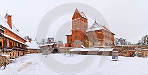 Wide angle view of inner courtyard of historical Trakai castle, Lithuania. Winter landscape